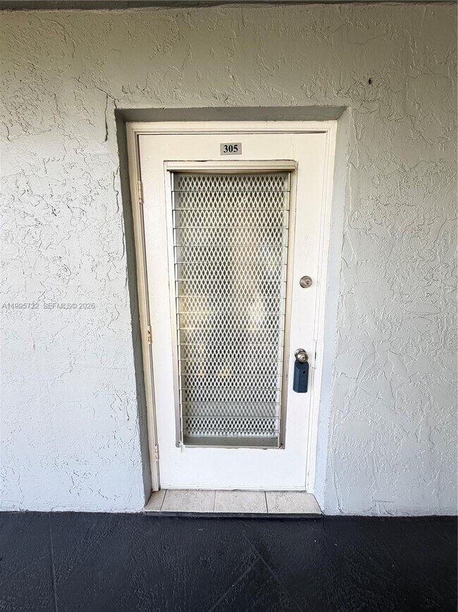 9201 Lime Bay Blvd in Tamarac, FL - Building Photo - Building Photo