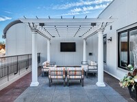 The oversized all-weather TV and sound system allow enjoyment all year round - Waldwick Station Apartments in Waldwick, New Jersey