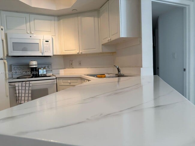 property at 8911 Collins Ave