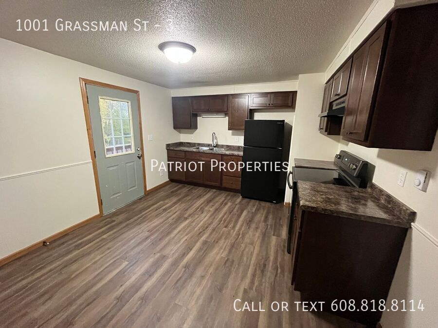 1001 Grassman St-Unit -3 in Tomah, WI - Building Photo