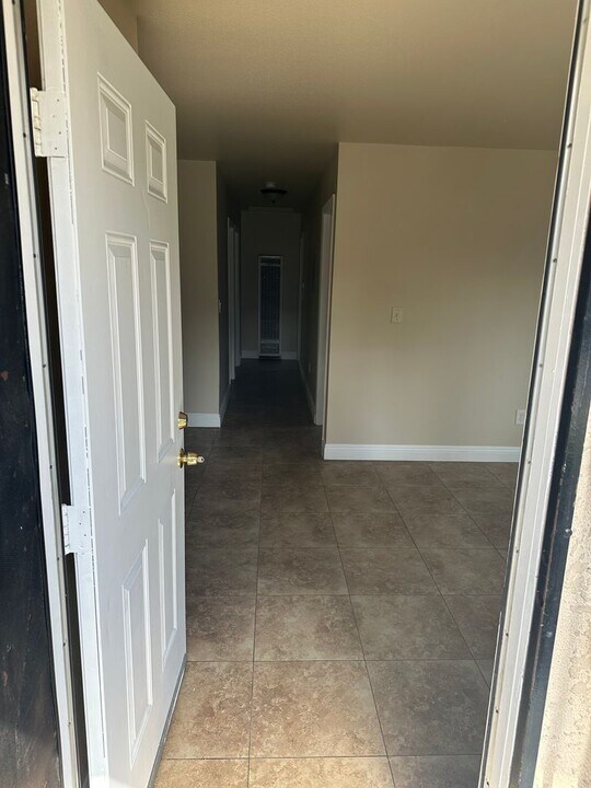 647 1/2-1619-1612 E 111th St in Los Angeles, CA - Building Photo