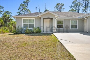 12009 Henley Ave in Port Charlotte, FL - Building Photo