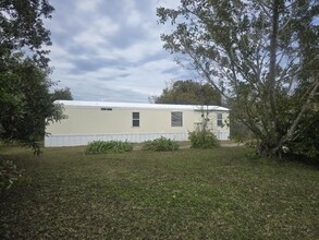 128 Center St, Unit 1 in Oak Hill, FL - Building Photo - Building Photo