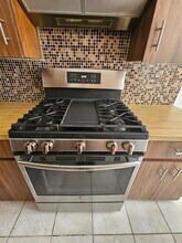 8718 31st Ave, Unit 2 BR/1 BA With Parking! in East Elmhurst, NY - Building Photo - Building Photo