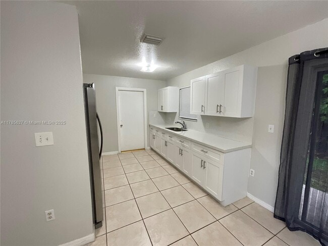 property at 211 SW 6th Ct