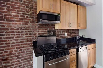 Perry Street in New York, NY - Building Photo - Building Photo