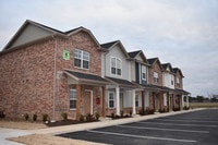 Townhome Exterior - Woodland Park at the Grove Apartments in Rogers, Arkansas
