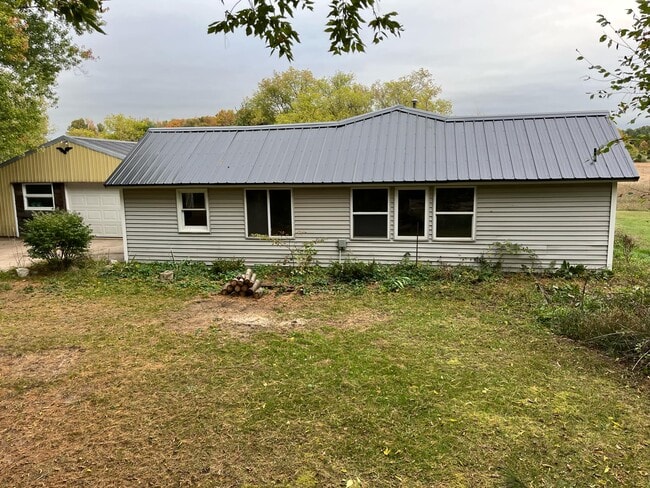 property at 9075 17 Mile Rd