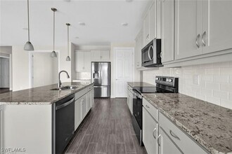 12329 Isabella Dr in Bonita Springs, FL - Building Photo - Building Photo