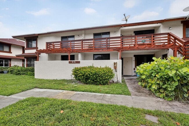 property at 615 NW 210th St