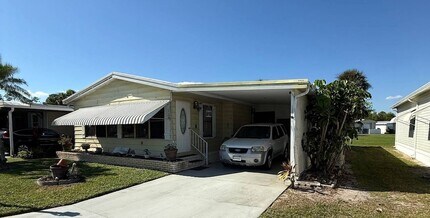 128 Needle Palm Ln in Naples, FL - Foto de edificio - Building Photo