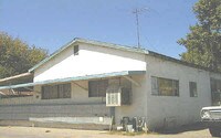 Building Photo - Sunrise Village Apartments in Modesto, California