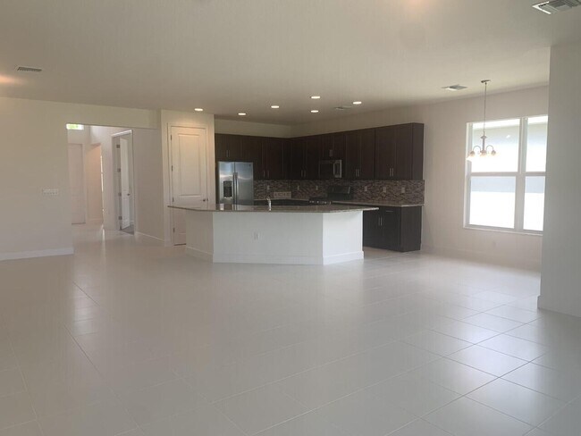 11933 SW Poseidon Way in Port St. Lucie, FL - Building Photo - Building Photo