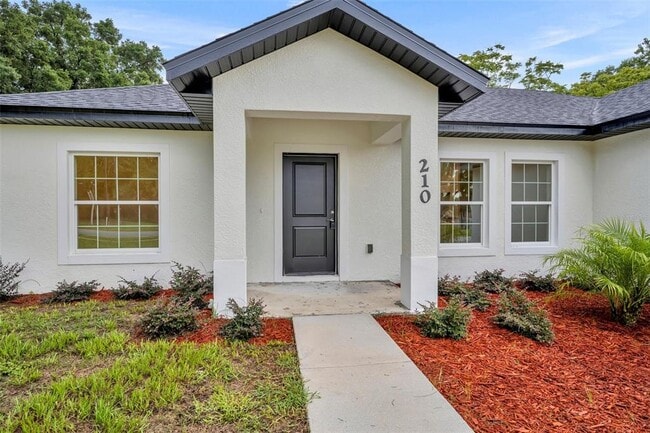 210 E Baxter St in De Leon Springs, FL - Building Photo - Building Photo