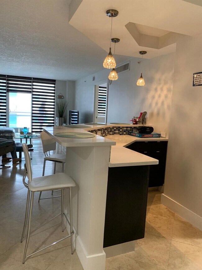 property at 6917 Collins Ave