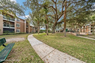 7667 N Wickham Rd, Unit 1201 in Melbourne, FL - Foto de edificio - Building Photo