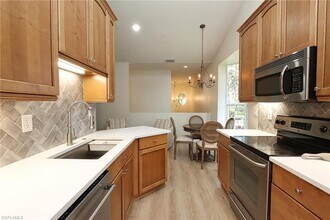 65 Silver Oaks Cir-Unit -201 in Naples, FL - Building Photo - Building Photo