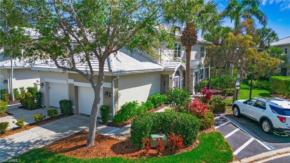 4690 Hawks Nest Way, Unit E204 in Naples, FL - Building Photo