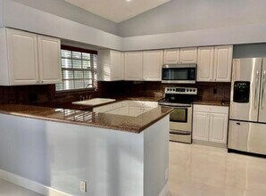 1103 Lake Breeze Dr in Wellington, FL - Building Photo - Building Photo