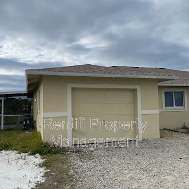 1130 Homer Ave S in Lehigh Acres, FL - Foto de edificio - Building Photo