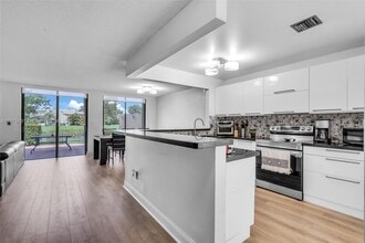 9931 Costa del Sol Blvd, Unit F-107 in Doral, FL - Building Photo - Building Photo