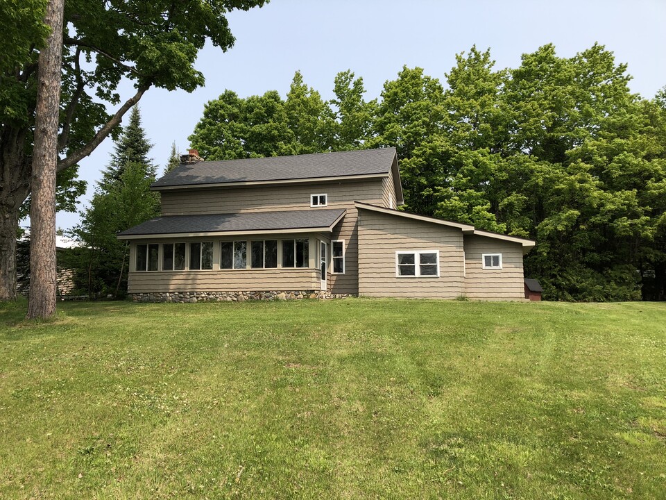 7990 Paradise Trl, Unit A in Carp Lake, MI - Building Photo