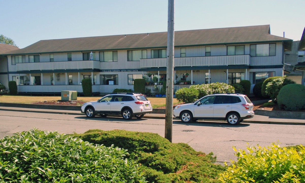 Village Green Apartments in Raymond, WA - Building Photo