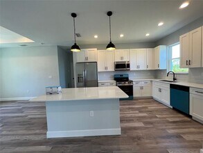 9243 Canna St in Port Charlotte, FL - Building Photo - Building Photo