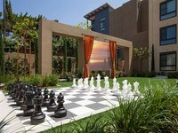 Join us for a movie under the stars or play a game of chess or checkers at Main Stage - Terrena Apartment Homes in Los Angeles, California