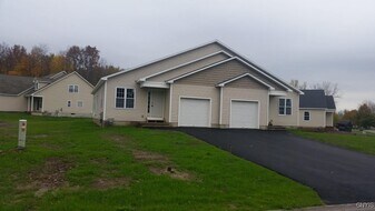 5585 St Elmos Dr in Brewerton, NY - Building Photo