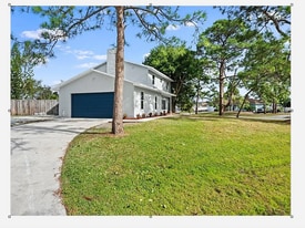 1741 SW Brisbane St in Port St. Lucie, FL - Building Photo