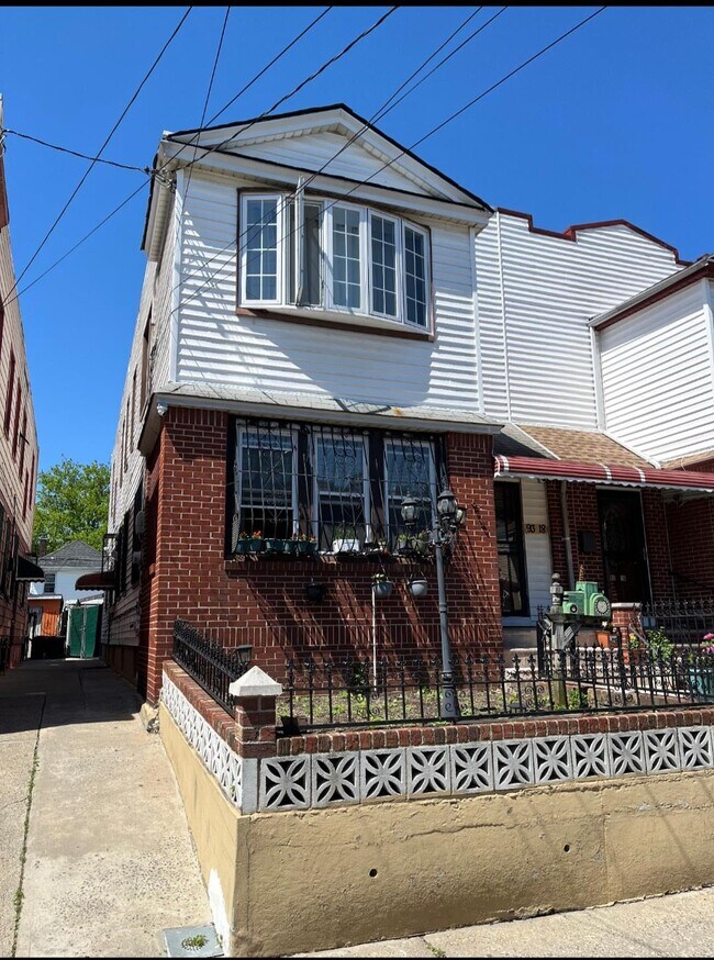 property at 93-18 202nd St