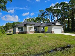 561 Harrisburg St SW in Palm Bay, FL - Building Photo - Building Photo
