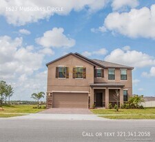 1623 Musgrass Cir in West Melbourne, FL - Building Photo