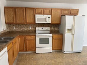 5241 Helena St, Unit 3-E-204 in Denver, CO - Building Photo - Building Photo