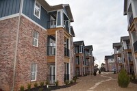 Apartment Exterior - Woodland Park at the Grove Apartments in Rogers, Arkansas