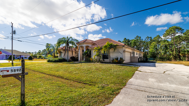 5892 NW Canada St in Port St. Lucie, FL - Foto de edificio - Building Photo