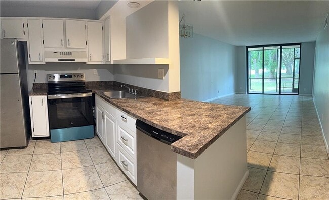 7750 W McNab Rd, Unit 104 in Tamarac, FL - Building Photo - Building Photo