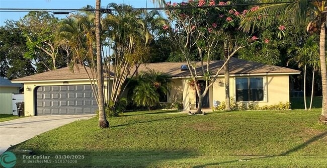 property at 3951 SW Cheribon St