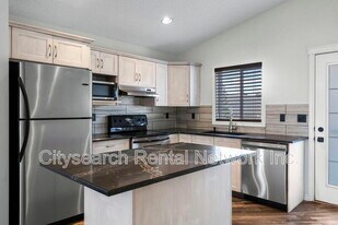 119 Cimarron Grove Crescent in Okotoks, AB - Building Photo
