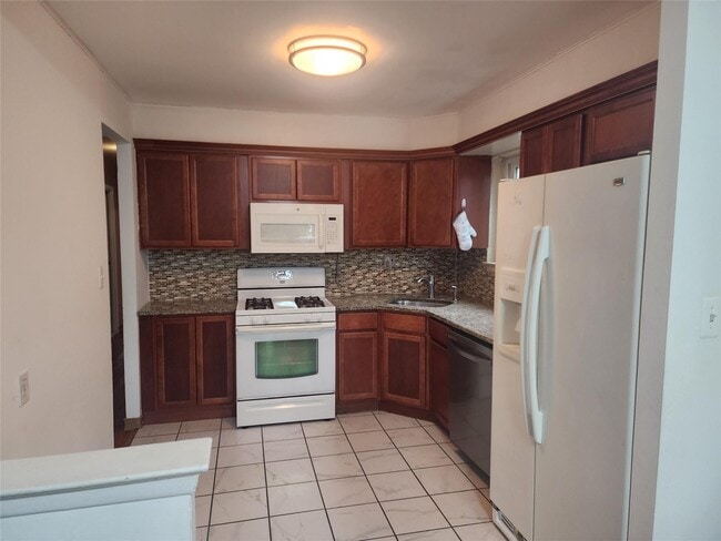 property at 65-08-65-77 77th St