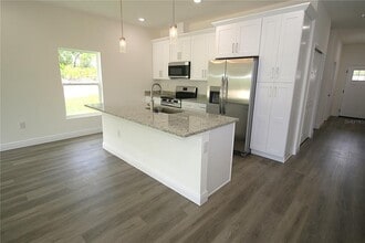 8990 Glenarm Way in Spring Hill, FL - Building Photo - Building Photo