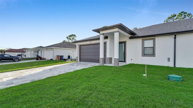 706 Homer Ave S in Lehigh Acres, FL - Building Photo - Building Photo