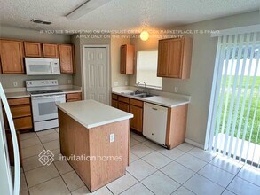 1921 Thorngate Ln in Mascotte, FL - Building Photo - Building Photo