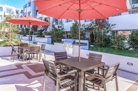 Outdoor BBQ Grilling Area - Woodley Sara Apartments in Los Angeles, California
