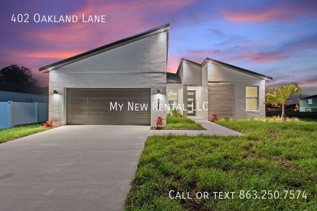 402 Oakland Ln in Poinciana, FL - Foto de edificio - Building Photo