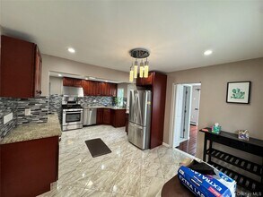 1438 Woolworth St in Elmont, NY - Building Photo - Building Photo