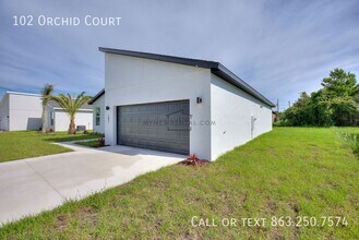 102 Orchid Ct in Poinciana, FL - Foto de edificio - Building Photo