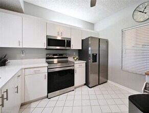 1070 Woodshire Ln-Unit -E103 in Naples, FL - Building Photo - Building Photo