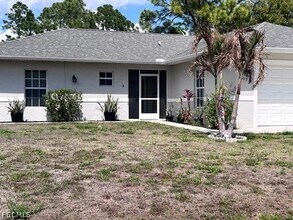 1107 Enrique St E in Lehigh Acres, FL - Building Photo - Building Photo